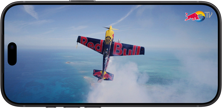 iPhone 18 Pro, mode paysage, photo d’un avion de voltige volant à la verticale dans le ciel au-dessus de la mer.